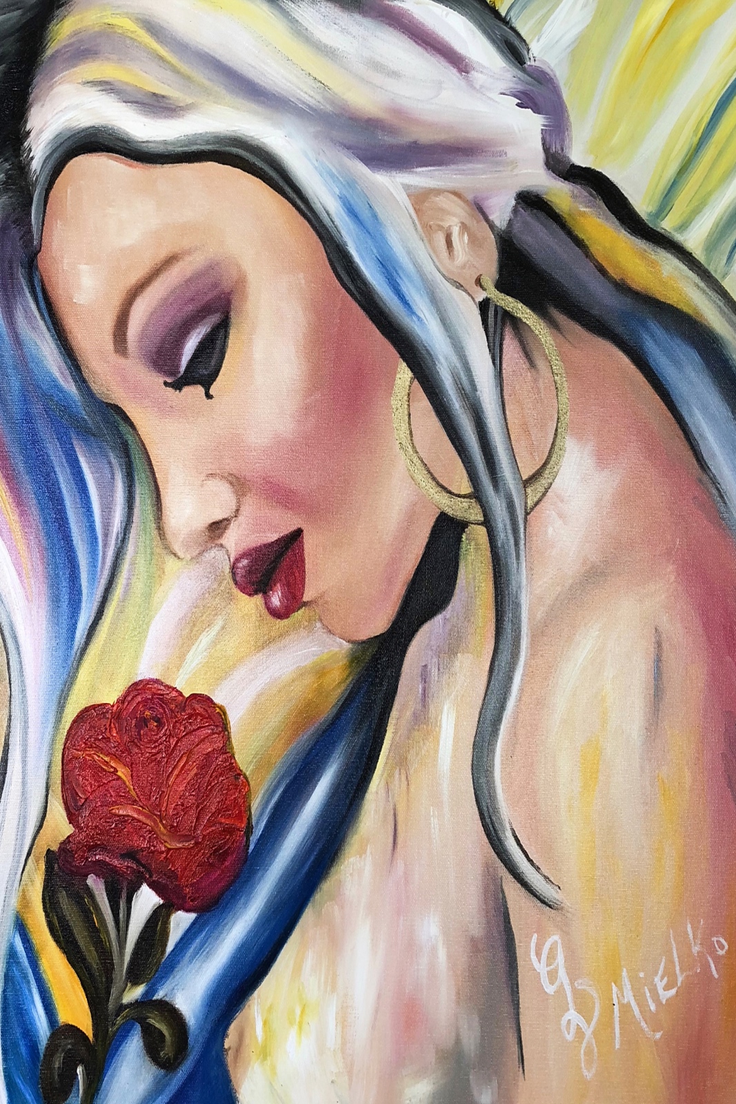 Stylized painting of a woman in profile with long flowing hair in white, blue, and black, gazing downward at a red rose she holds. Her warm skin tone, purple eyeshadow, red lipstick, and gold hoop earrings add vibrancy and a Latin feel to this abstract. Abstract background of swirling yellow, blue, and white evokes themes of reflection, beauty, and emotional stillness. Signed “GV Mielko.” This contemporary figurative artwork appeals to collectors of symbolic portraiture, emotionally resonant mixed-media, and feminine introspection. Ideal for curators seeking narrative-driven works that explore grace, longing, and the quiet power of presence through vibrant visual storytelling.